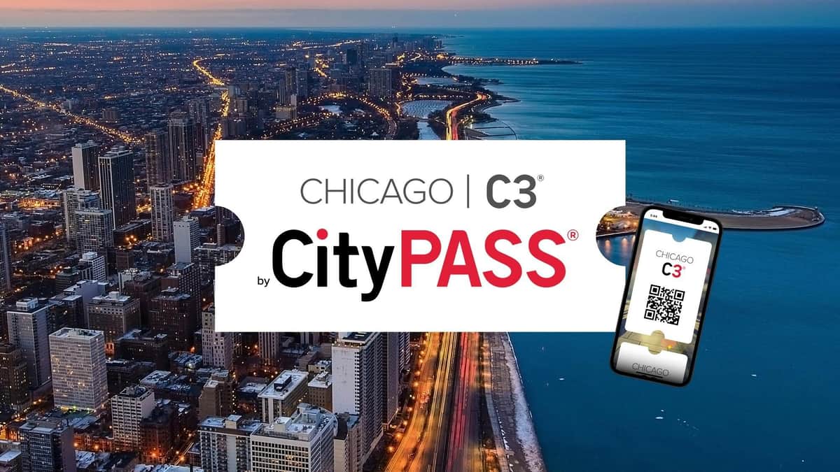 Aerial view of Chicago at dusk with illuminated buildings and roads, overlaid with "Chicago C3 by CityPASS" text and a card image.