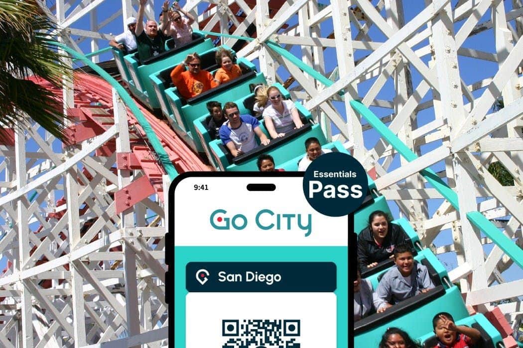 People riding a rollercoaster with a phone screen in the foreground displaying a "Go City San Diego Essentials Pass."